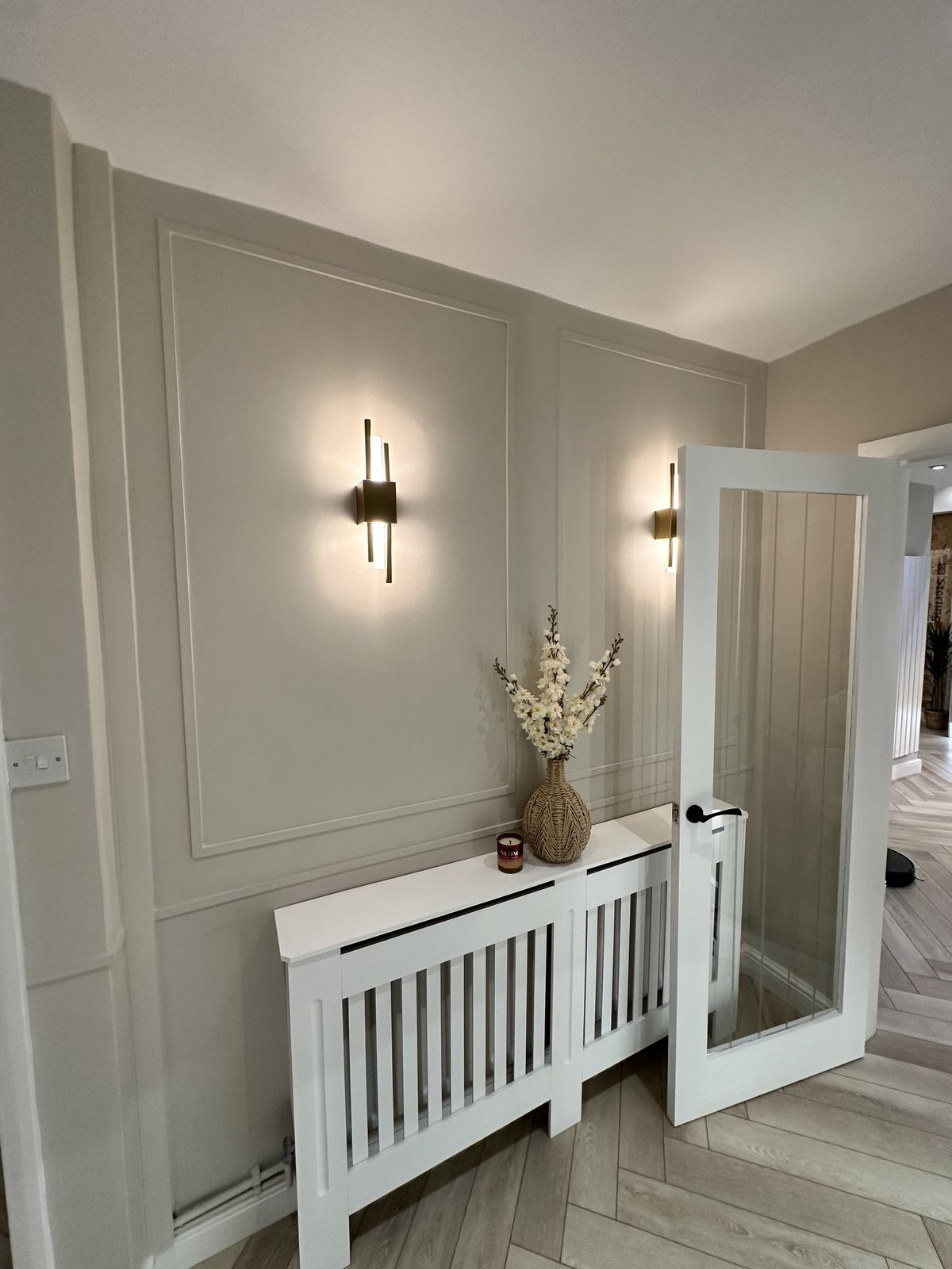 Hallway panelling with wall lights